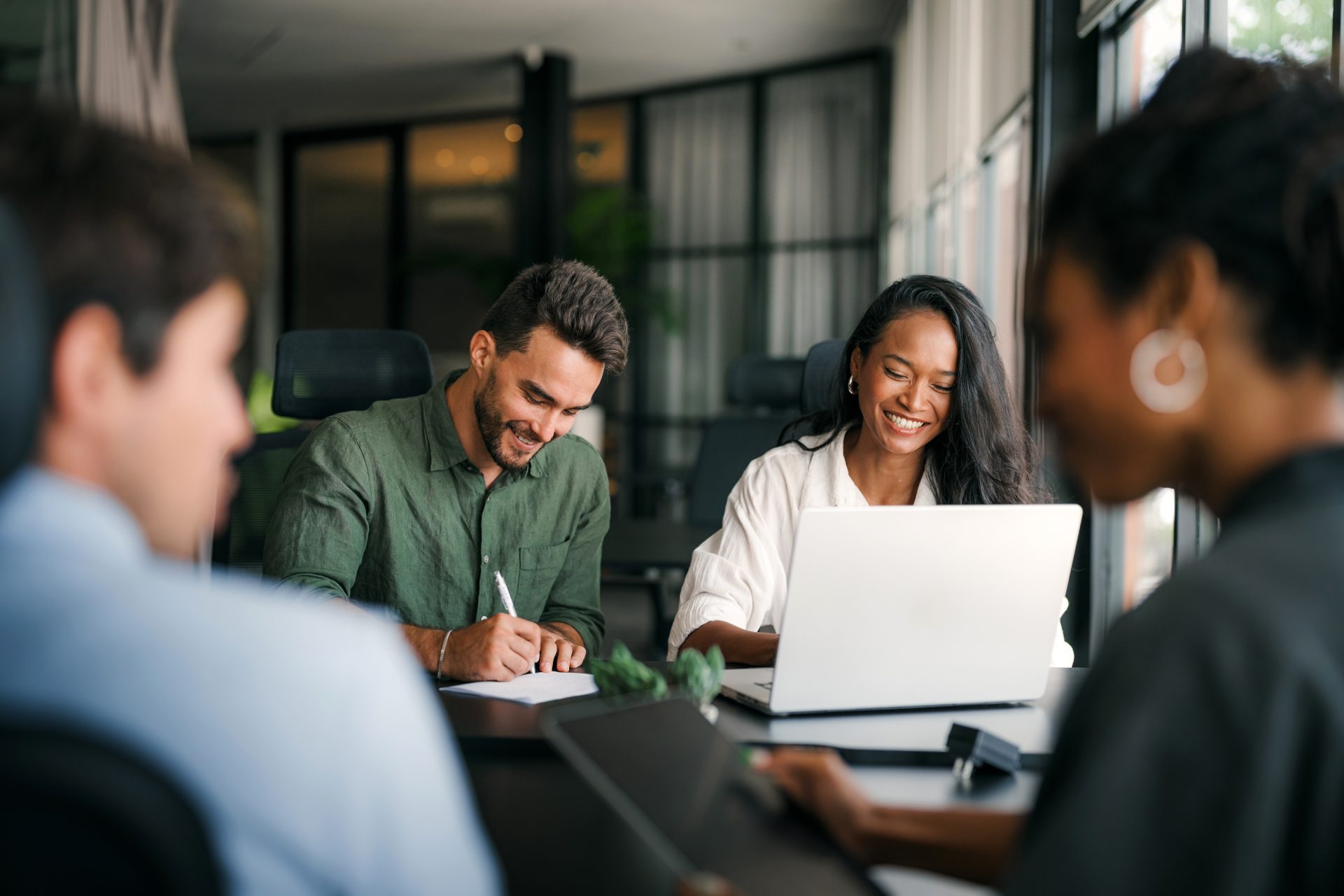 People sitting and working together in a workplace setting,
