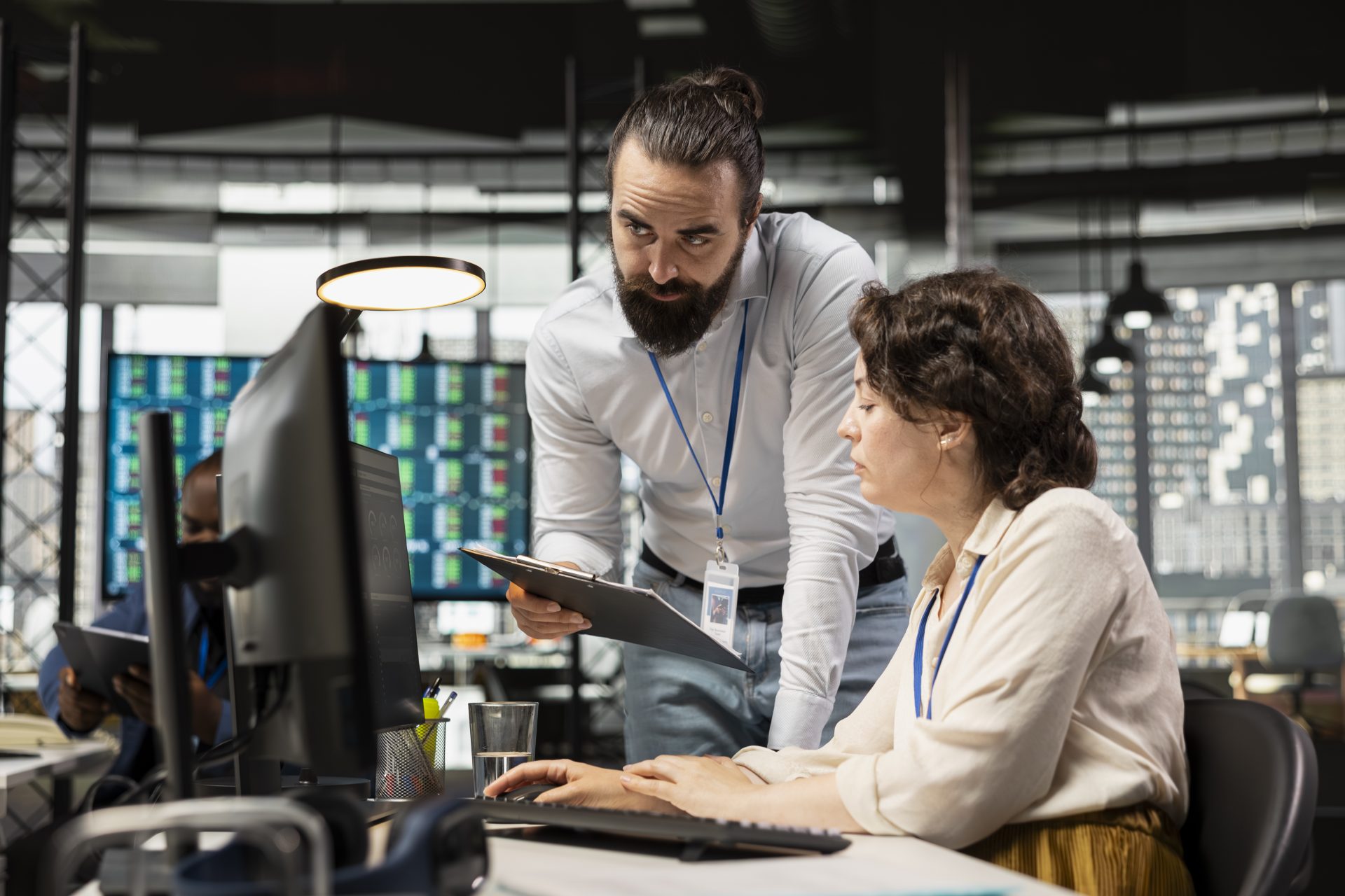 Person focused in on work with her coworker.